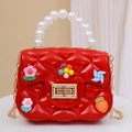 Mini red quilted kids cross-body bag with pearl handle and cartoon charms - With Random Patches / Red
