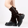 Detail view of dark brown knitted leg warmers with side zipper and ribbed texture - One Size / Coffee