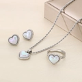 Silver heart jewelry set with necklace, ring, and earrings on a textured background - 3-Piece Set (Ring Size 6) / Silver
