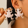 Gold frog stud earrings with white faux pearls and rhinestones on model's ear - KC Gold H-137