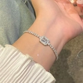 Close-up of a silver-tone tennis bracelet with a rectangular zircon stone on wrist - 37# Silver Halo Square Style