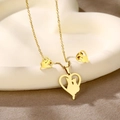 Detailed view of gold heart necklace and cat stud earrings set on a white tray - Heart Cat (TZ-426)