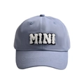 Detailed close-up of MAMA embroidered letter logo on blue cotton baseball cap - MINI-Blue