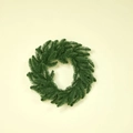 Lush green artificial Christmas wreath with dense pine needle textures on a warm background - 40CM Original Green Wreath