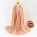 Chiffon pearl scarf in salmon pink draped elegantly with a close-up of fabric texture - Hot Pink