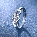 Elegant silver heart ring with sparkling stones on a blue bokeh background - White Gold Ljz-207 / Adjustable Open