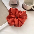 Detailed texture of an oversized burnt orange satin scrunchie with silky fabric folds - 12#Orange Red