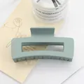 Detail of sage green matte square hair claw clip with smooth frosted finish and strong grip - Green