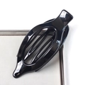 Glossy black oval cutout hair claw clip on a luxury tray, professional accessory view - Bright Black