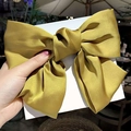 Ginger yellow satin bow hair claw clip for women on display card in natural sunlight - Big Bow #Yellow