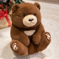 Dark brown teddy bear plush in sitting pose with festive Christmas gift box background - 28cm / Brown