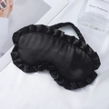 Seidige Schlafmaske in Schwarz mit eleganten Rüschenkanten und elastischem Kopfband - Schwarz