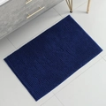 Top view of a blue rectangular chenille bath mat with soft texture in a modern bathroom - 50*120CM / Dark Blue