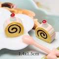 Macro shot of 1.4x1.5cm miniature resin Swiss roll cake slices with cream and cherry - Yellow (Style B)