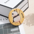 Portable mini round pocket mirror featuring cute panda print and yellow finish - Panda Back View