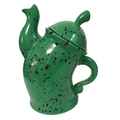 Close-up of green ceramic canister with attitude featuring red and black spotted glaze pattern - Green Pot