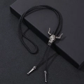 Detail of western vintage bull skull bolo tie with black braided leather and silver tips - One Size / Antique Silver Ram Skull