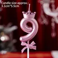 Number 9 birthday candle in rose gold with a crown and pink ribbon bow detail - Number Candle Pink With Crown And Bow (9)