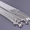 Detailed close-up of 2.5mm stainless steel keel chain with durable lobster clasp connector - Silver