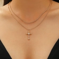 Double-layer gold necklace with cross pendant and snake chain shown on model - Gold Snake Bone Cross (WG-0117)