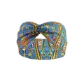Blue paisley elastic yoga headband with a stylish crossover knot design for active women - Blue Wave Print