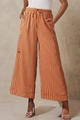 Detail of colorful vertical stripes, elastic drawstring waist and side pockets on wide-leg pants - Brown