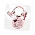 Close-up of rose gold Class of 2026 graduation keychain with engraved quote and charms - Rose Gold (xk126)