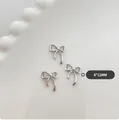 Tres adornos para uñas con lazo plateado de 8x11mm en bandeja de cerámica - Grande-Color Platino