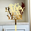 Close-up of golden mirror acrylic Happy New Year cake topper with star cutout details - Gold 2026 Style G