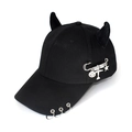 Detail of black baseball cap with devil horns, silver metal rings and pin charms - Safety Pin Airplane Black
