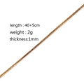 Golden box chain necklace showing 1mm thickness and 40+5cm length on white background - Box Chain