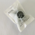Hemispherical black konjac sponge for face cleaning in a reusable sealed bag - Bag Packaging / Bamboo Charcoal Black