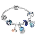 Macro detail of silver marine charms with blue beads, sea creatures and magic engraving - 16cm / Style A4/Globe Chameleon Magic Theme