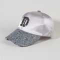 Close-up of lilac satin baseball cap featuring a diamond-studded D and glittery brim - Style 32-Purple Satin Sequin CENICENI D