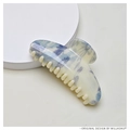 Detailed view of the large cream hair claw clip with delicate blue floral patterns - 10.7cm Semicircle / Cream & Blue Floral