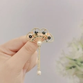 Detail of fan-shaped golden brooch with pearls and hanging chain tassel in vintage style - Hollow Fan