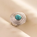 Macro shot of turquoise stone ring with spiral metal layers on beige fabric - Silver Base-Light Blue Stone