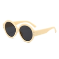 Gafas de sol redondas retro color crema con lentes oscuras y remaches metálicos laterales - Montura Amarilla Lentes Grises