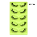 Detail shot of 5 pairs of 3DY94 black cat-eye false eyelashes on a green tray - Dense Curled Shape (3DY94)
