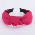 Detailed macro view of the rose red knotted fabric headband showing weave texture - Rose Red