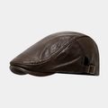 Detail of dark brown leather ivy cap showing side metal buckle and textured finish - One Size / Dark Brown