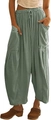 Détail du pantalon sarouel en coton et lin vert sauge avec taille élastique et poches latérales - Vert