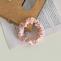 Elegant pink satin scrunchie with a pleated design for a stylish ponytail accessory - Light Pink