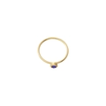 Detailed close-up of a minimalist gold ring with a round blue gemstone in bezel setting - US Size 7 / Gold-Blue (Sep)