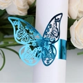 Elegant laser-cut blue butterfly napkin ring with intricate hollow floral patterns - Reflective Blue