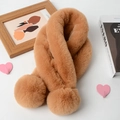 Detail of brown faux fur scarf with soft pom-poms on a cozy lifestyle background - Khaki