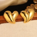 Chic 18K gold plated heart stud earrings on a beige linen display for beach vacation look - Gold Bright Polished 3D Heart Stud Earrings