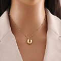 Elegant gold-tone stainless steel letter U pendant necklace with small bead chain details - Letter U