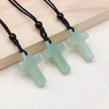 Cross pendant necklace made of light green natural aventurine with black braided cord - Green Aventurine