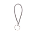 Detail of grey rhinestone braided keychain with silver metallic ring and spring clasp - Gray